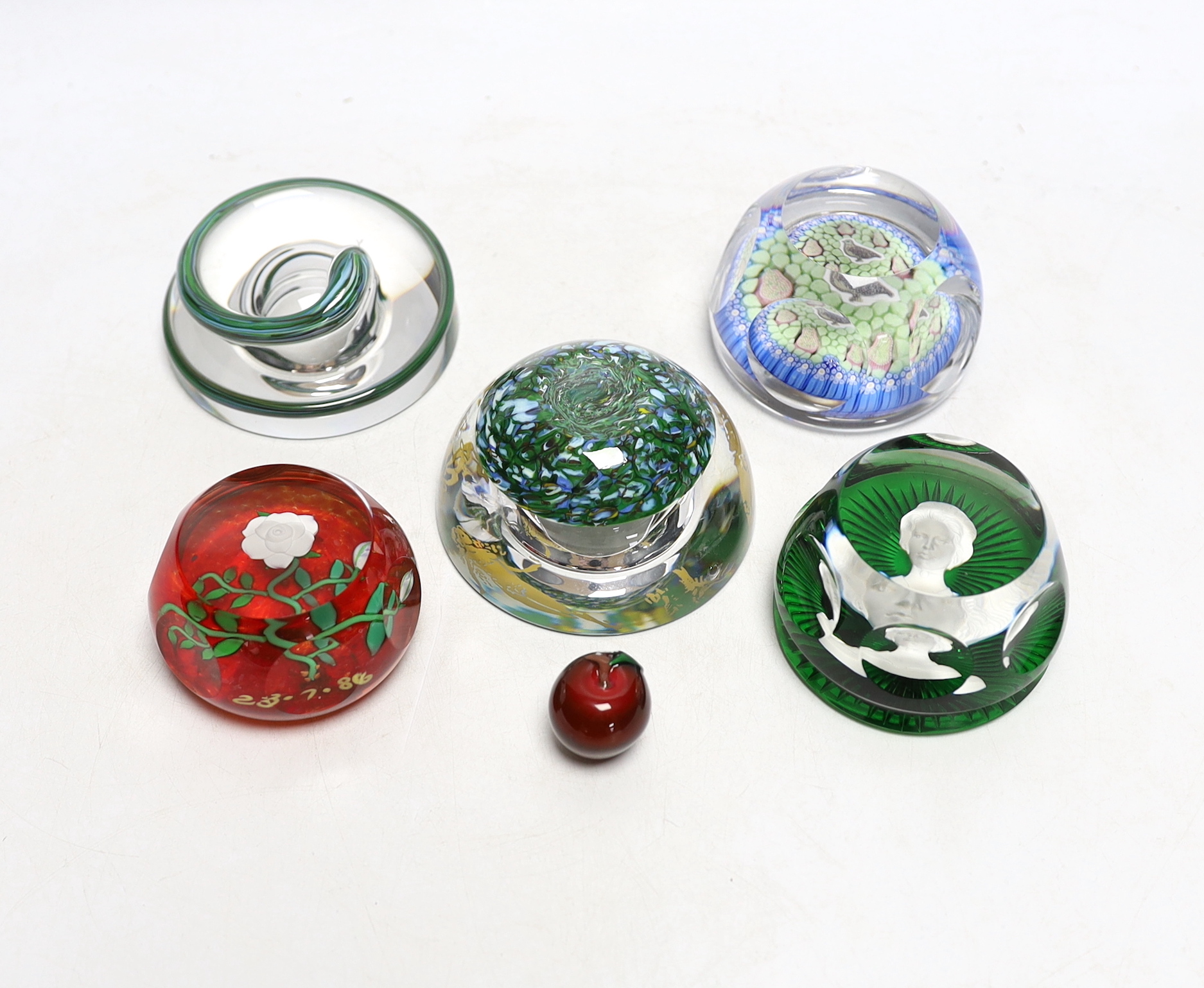 Four boxed paperweights including St Louis Adam & Eve, Baccarat sulphide, Perthshire etc.